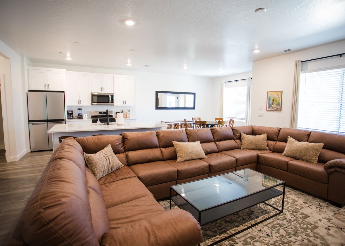 Open living area with leather sectional