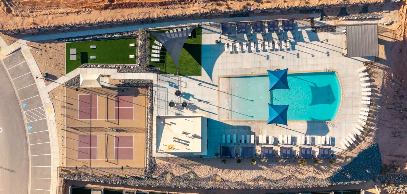 Aerial view of Long Valley amenities — pool, pickleball courts, lawn and lounge area