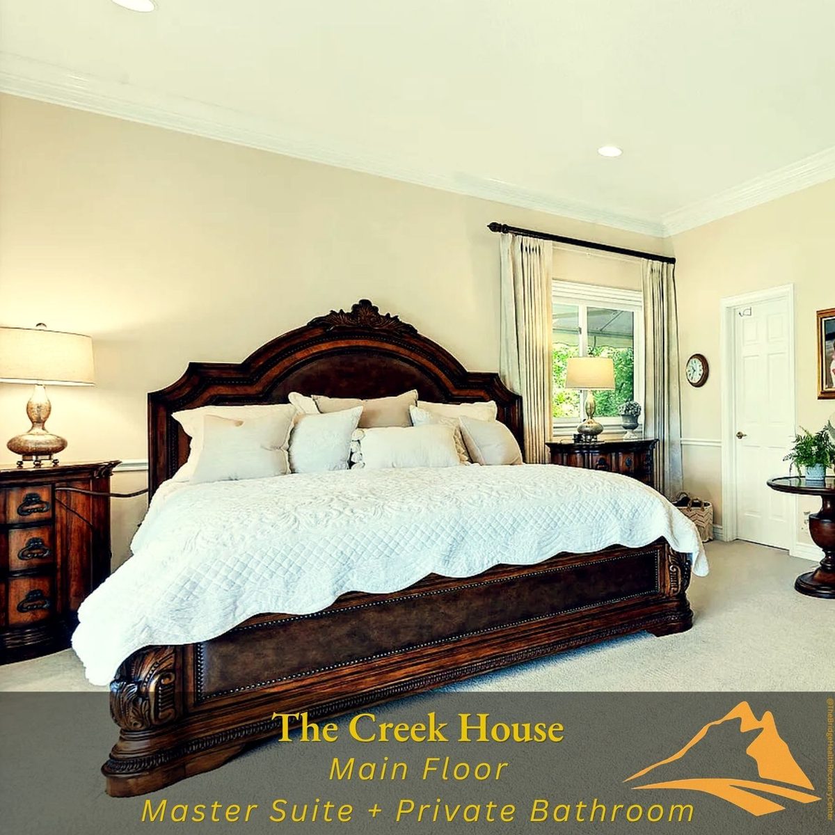 Master suite bedroom on main floor at The Creek House