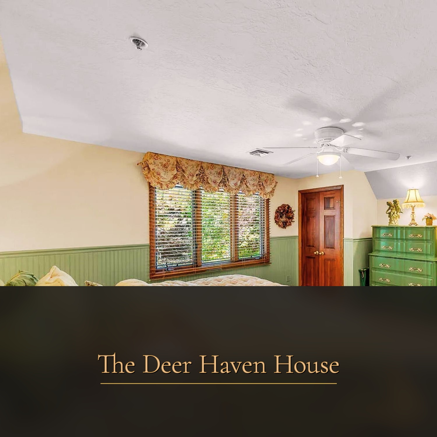 Upstairs bedroom with green wainscoting at The Deer Haven House