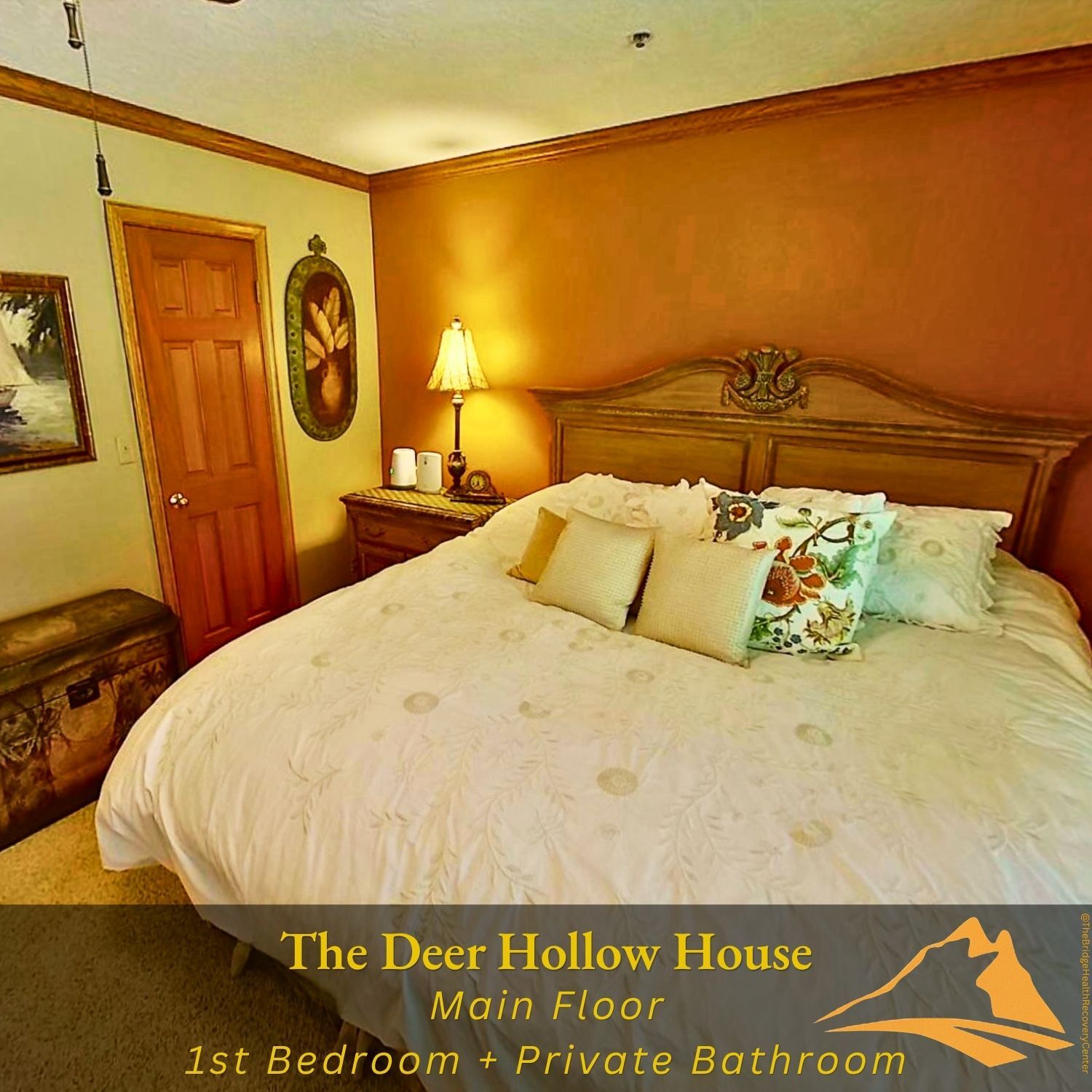 Main floor first bedroom with ornate headboard at The Deer Hollow House