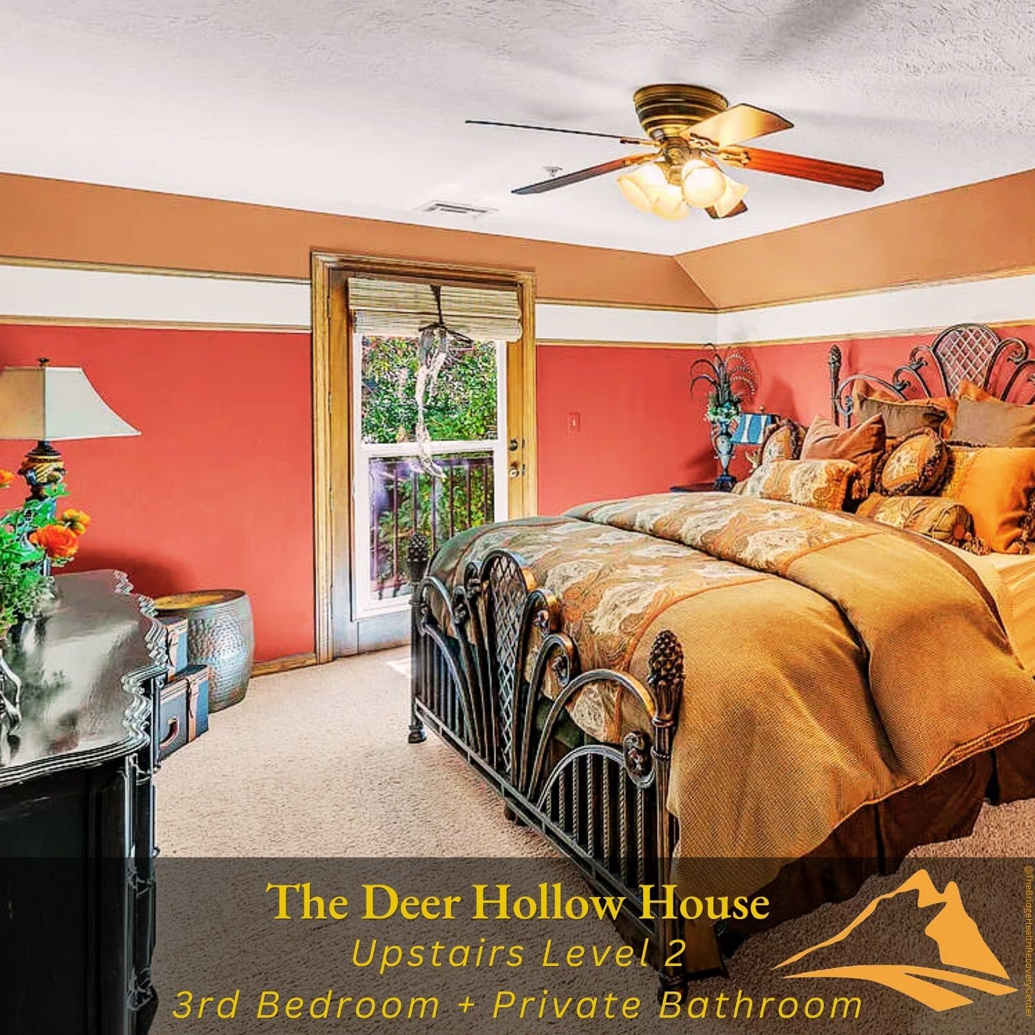 Upstairs bedroom with coral accent walls at The Deer Hollow House