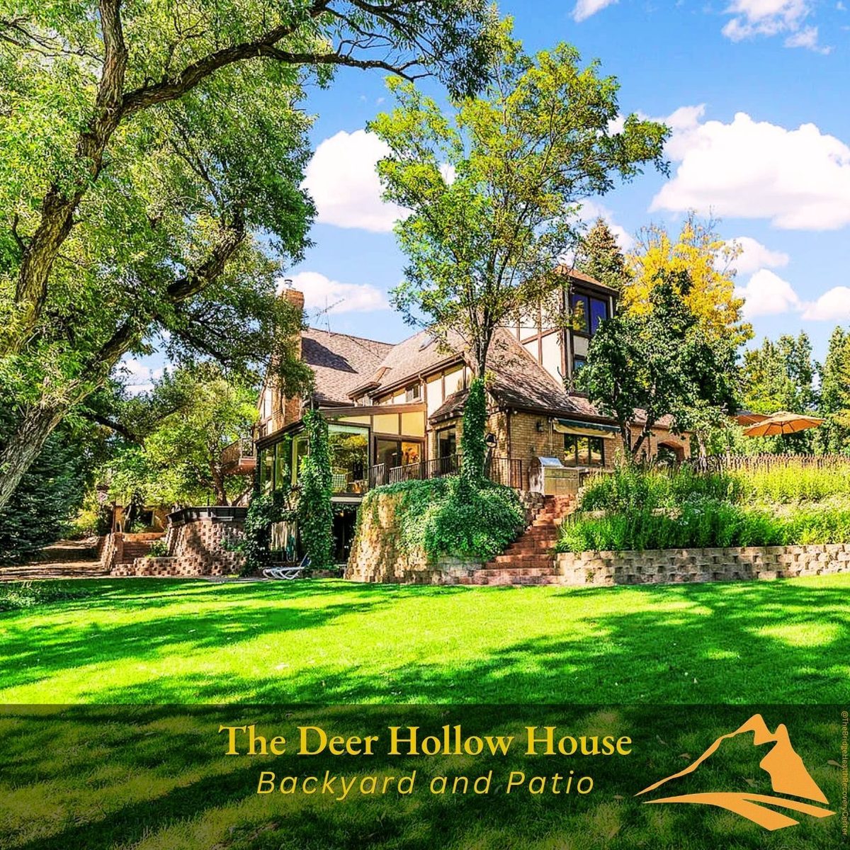 Brick patio with outdoor dining at The Deer Hollow House